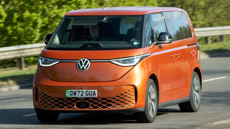 Orange Volkswagen ID. Buzz on a European highway