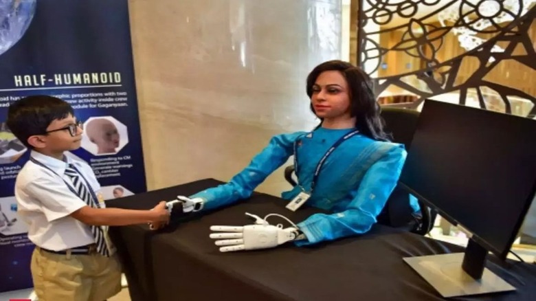 Picture of Indian half-humanoid astronaut Vyommitra with child