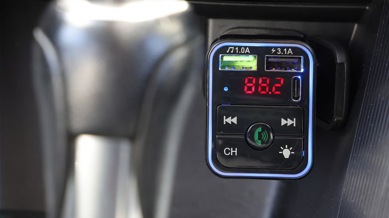 Onn Bluetooth FM Car Charger inside of a car's auxiliary power outlet.