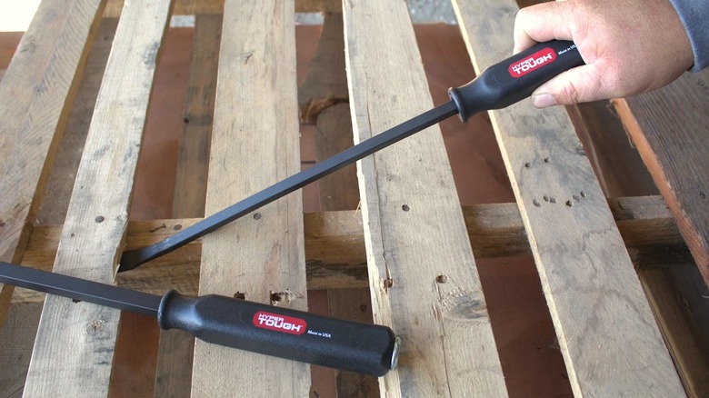 Person using a Hyper Tough Pry Bar