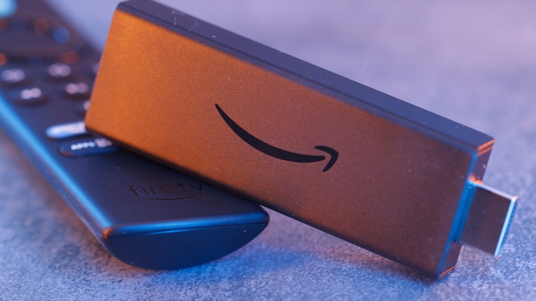 Amazon Fire TV Stick next to its remote