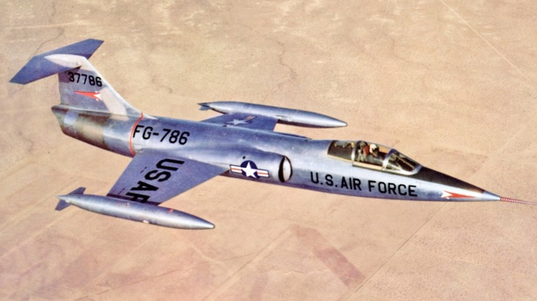 A Lockheed XF-104 Starfighter flying over the desert