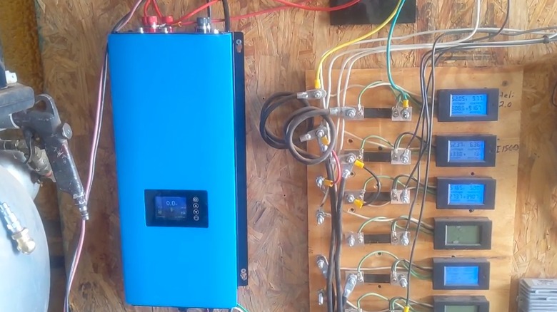 A wind turbine inverter setup on wood.