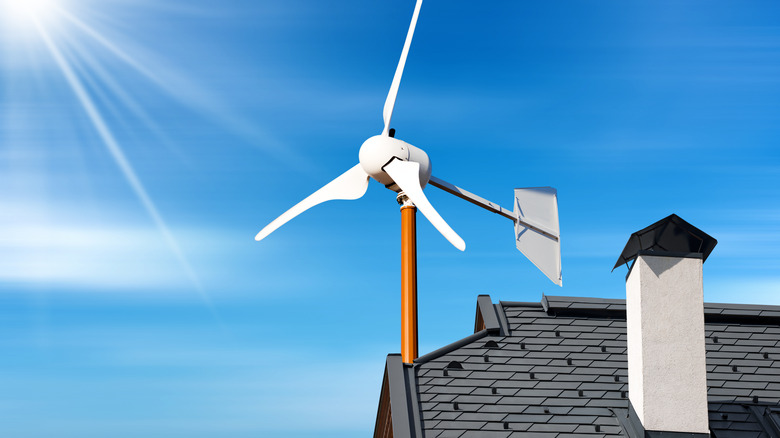 A wind turbine mounted to a rooftop.
