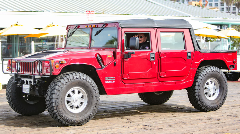 Arnold Schwarzenegger driving a Hummer