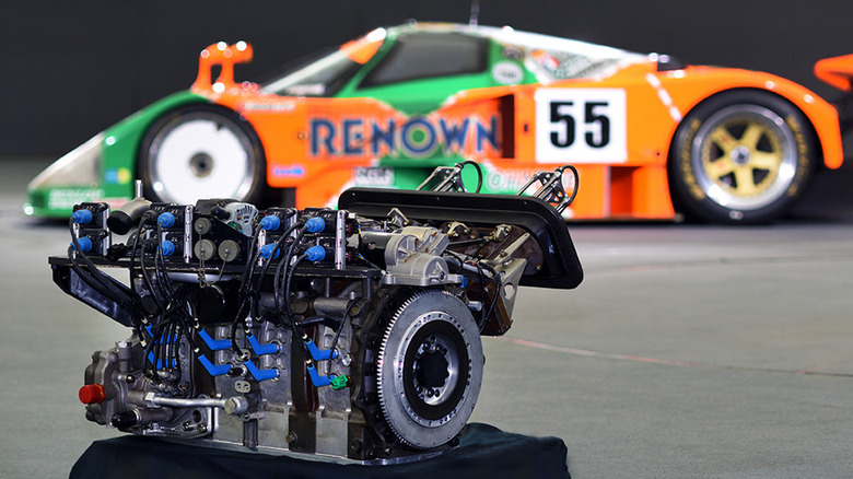 R26B engine with a Mazda 787B in the background