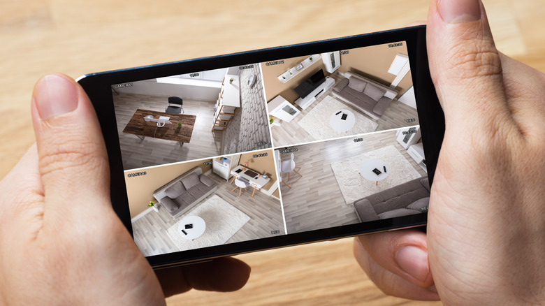 Security camera footage shown on a smartphone screen