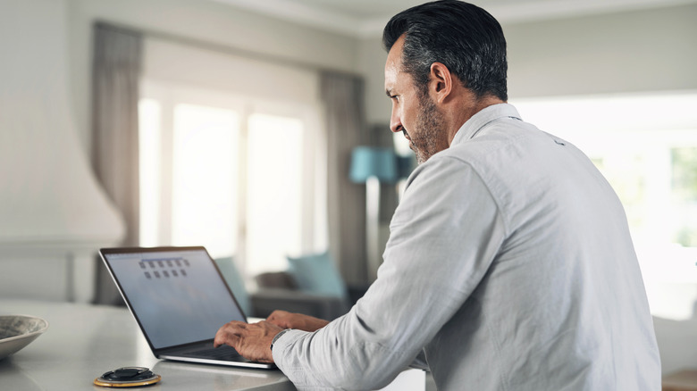 Person typing on laptop