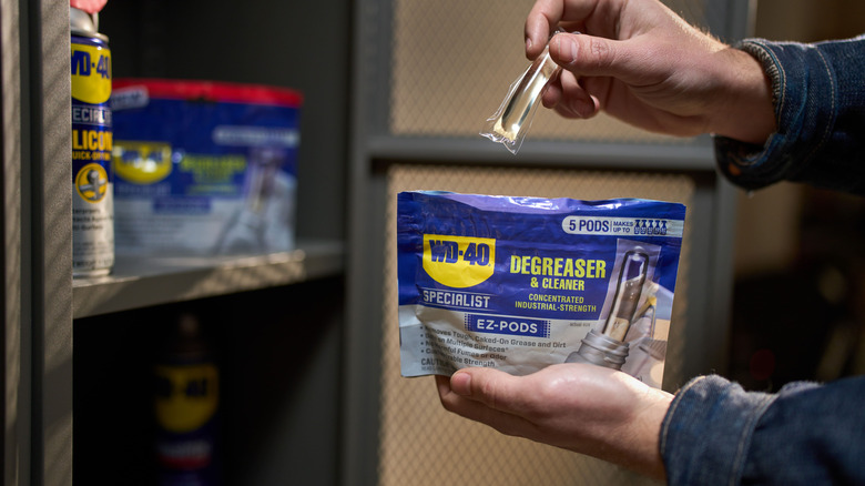 person holding bag of WD-40 Specialist Degreaser and Cleaner EZ-Pods