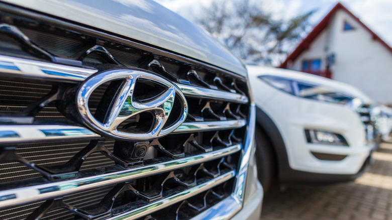 A closeup on the Hyundai logo on the front of a vehicle