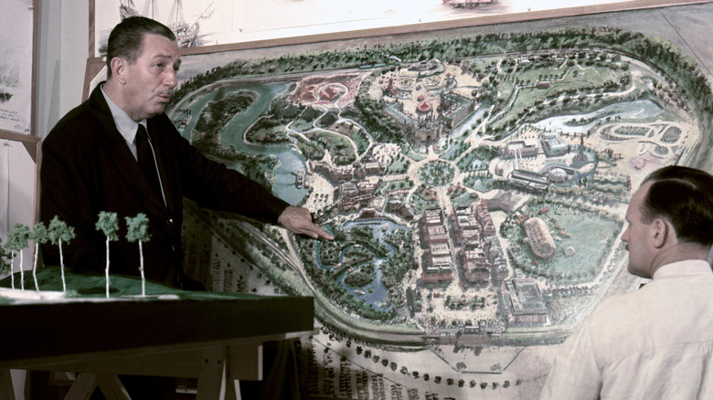 Walt Disney discusses Disneyland plan with an Imagineer