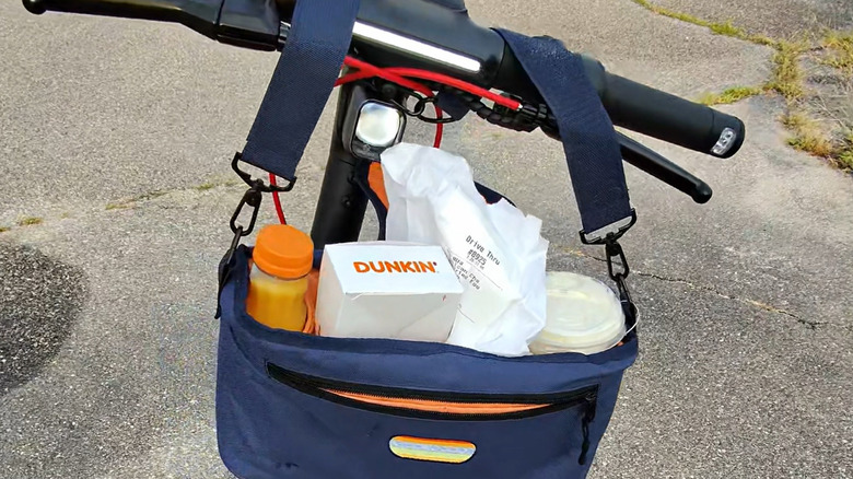 CrapKeeper hanging from the Segway Max G3 Plus handlebars