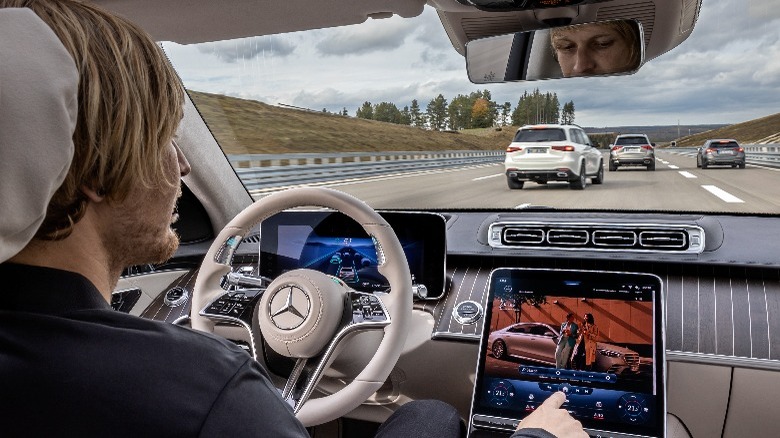 Person driving Mercedes vehicle