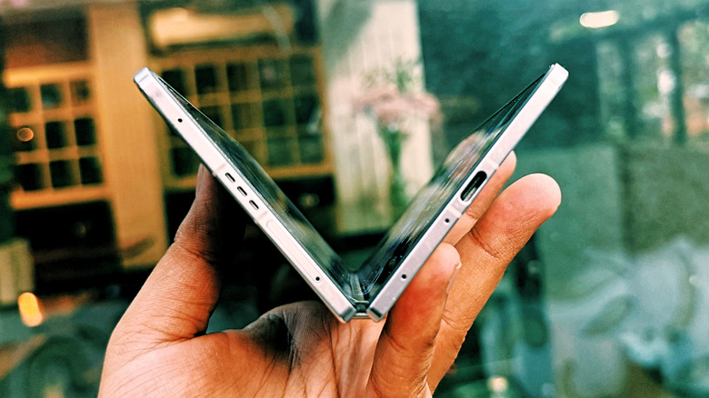 Holding Oppo Find N5 in hand