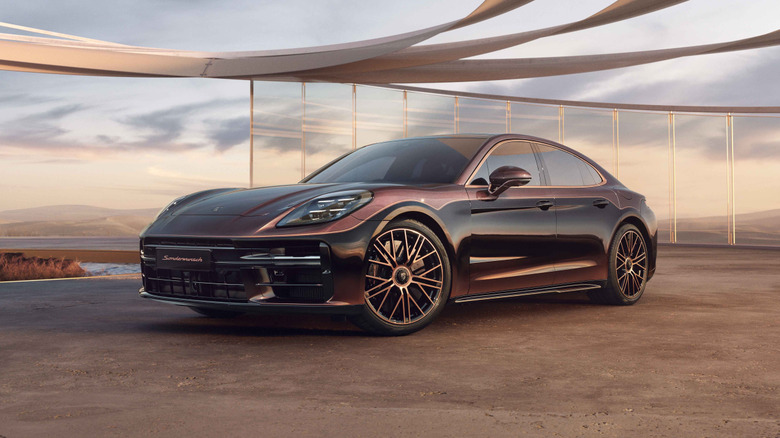 A luxurious Porsche Panamera parked in a futuristic sand setting.
