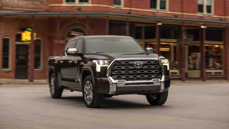 Toyota Tundra 1794 on the move in a town, front 3/4 view