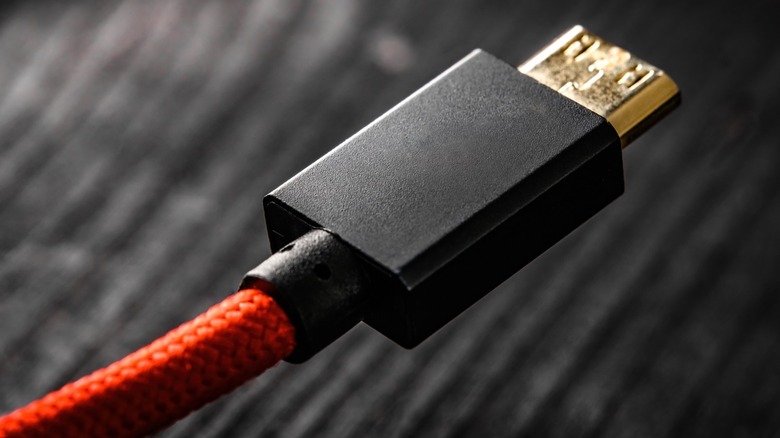 Close up of the connector on a braided red HDMI cable