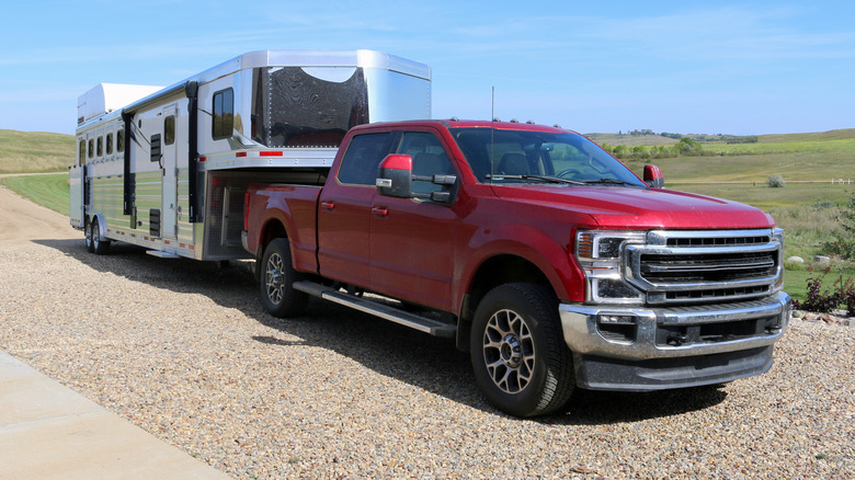 Pickup truck parked with a heavy camper attached
