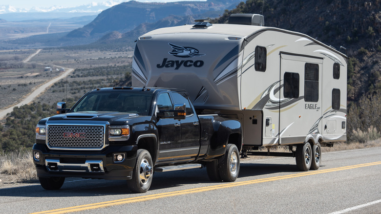 Truck towing a trailer through the mountains