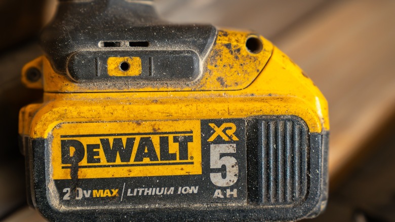 A dirty 20V 5Ah cordless tool battery from DeWalt.