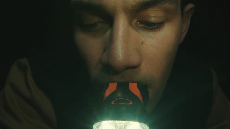 Close-up of an illuminated Illumibite Pro in user's mouth.