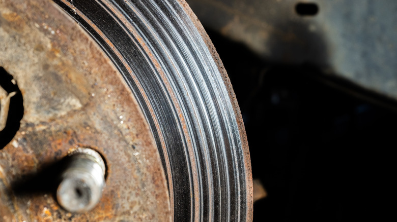 Damaged brake rotor with visible grooves