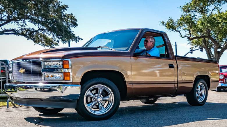 Brown 1993 Chevrolet C1500 pickup truck in the sun