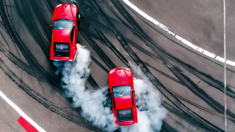 two cars drifting on track