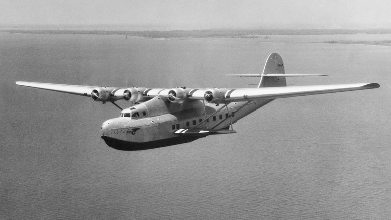 Pan American Airways Martin M-130 flies over water