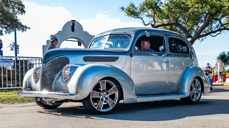 light-blue Ford Super Deluxe parked