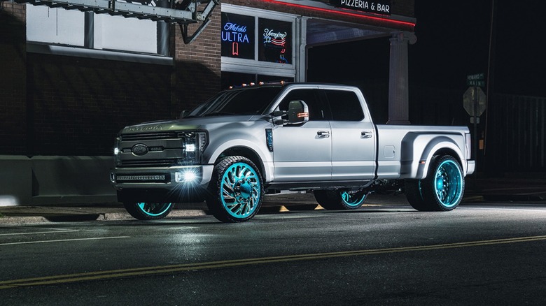 A gray Ford pickup truck with custom forged wheels