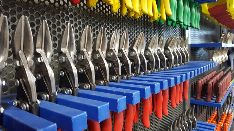 A selection of hand tools on display in a hardware store.