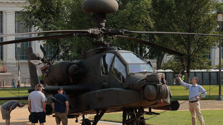 Apache helicopter on display outdoors.
