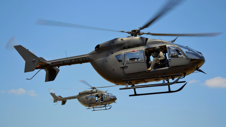 Two Lakota helicopters in flight.