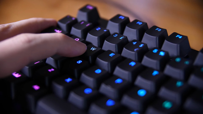 A person pressing an optical key switch