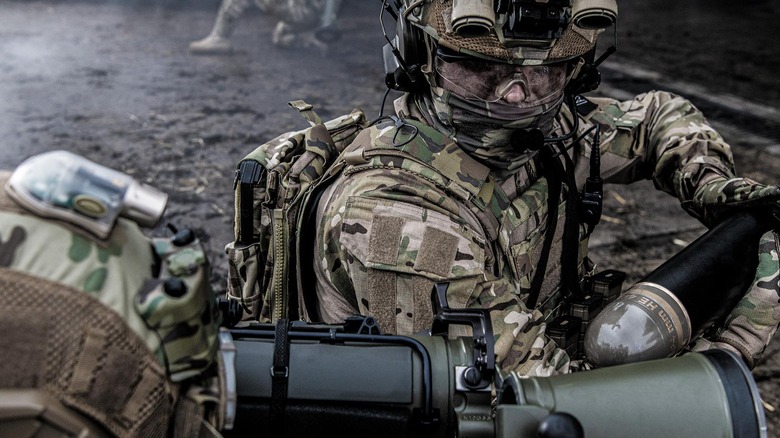 Carl Gustaf M4 being loaded with an HE 448 programmable ammunition by a soldier