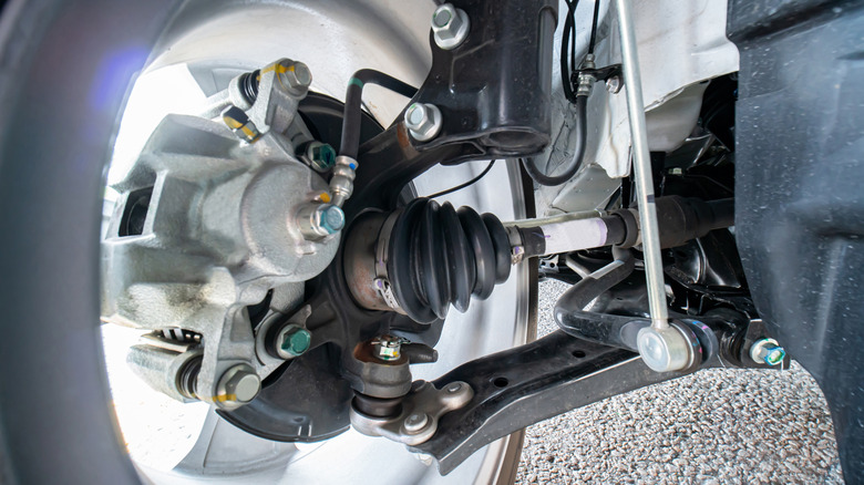 The knuckle joint with suspension and steering bushings