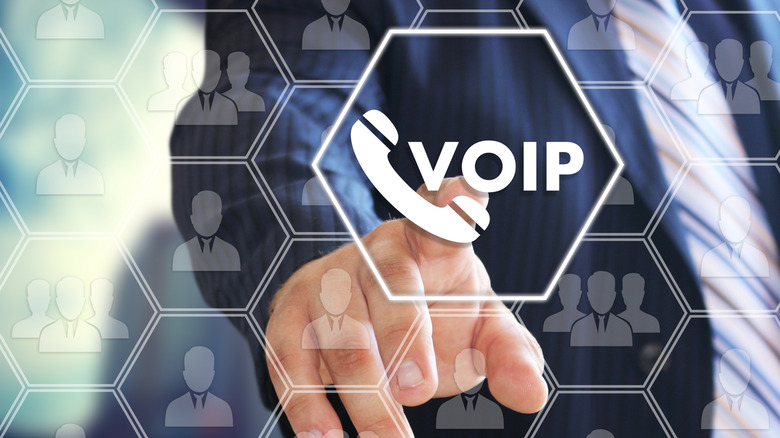 A person chooses VOIP on the virtual screen in social network connection.