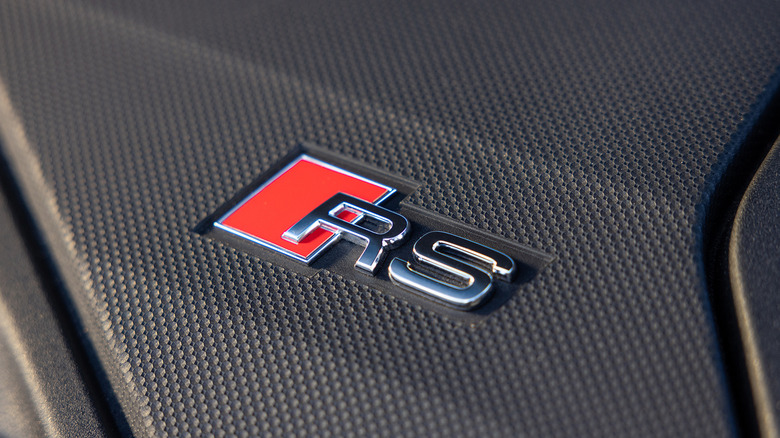 Detail shot of Audi RS logo and carbon fiber pattern on Audi RS3.
