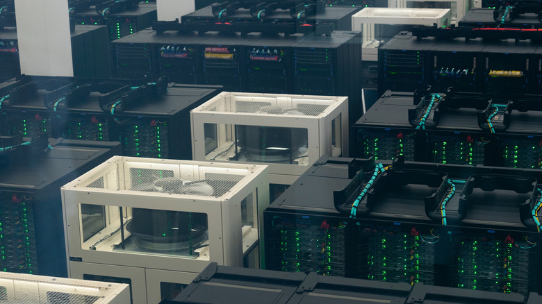 Supercomputer infrastructure inside modern data center with server racks and cabling