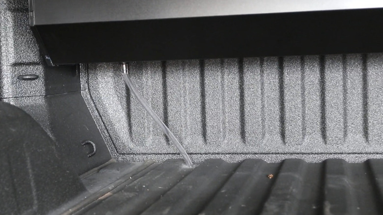 Drain tubes in a truck bed