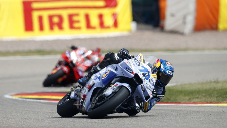 motogp racers leaning to the left