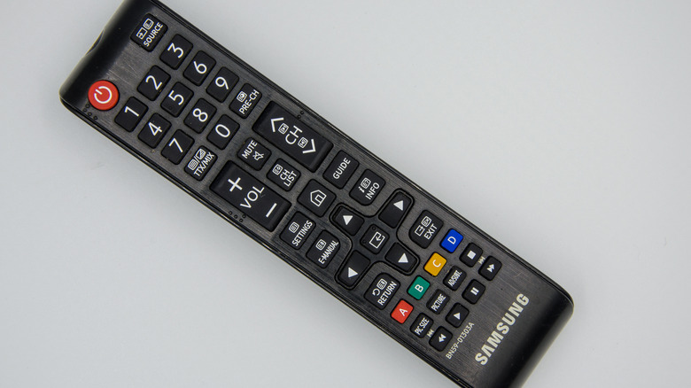 Older generation Samsung TV remote with physical colored buttons