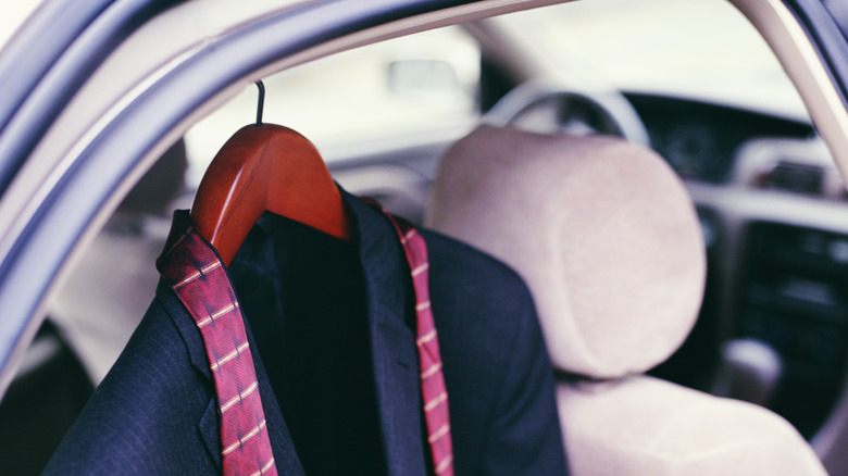 Jacket hanging above rear seat of a car