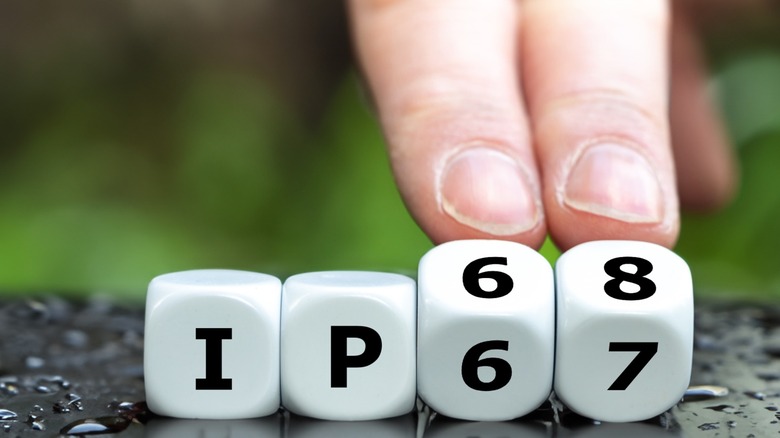 Dice spelling IP67 being turned to spell IP68