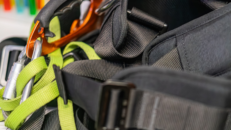 Black backpack with carabiners attached to the loops