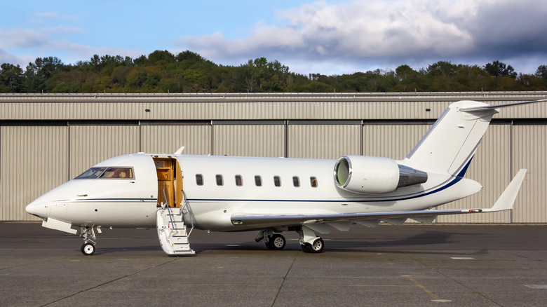 The image shows a Bombardier Challenger 650 corporate business jet aircraft