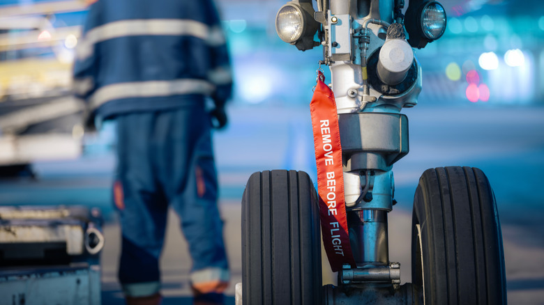 Remove before flight tag on aircraft landing gear