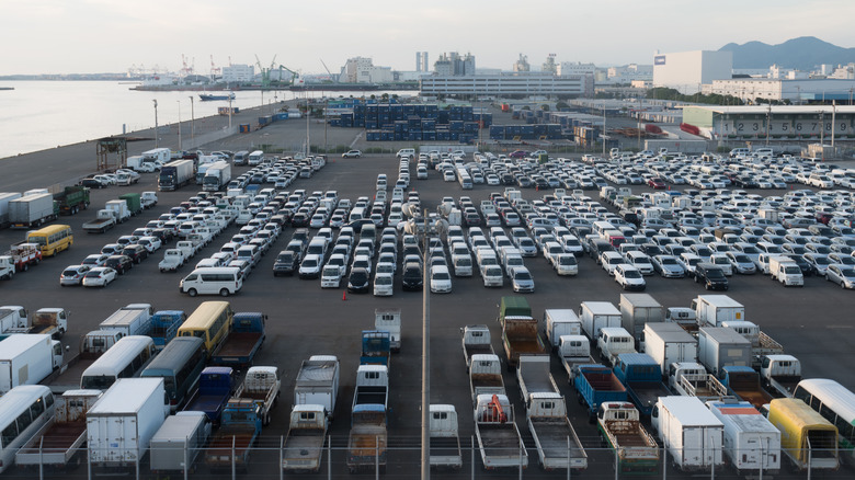Various cars parked at port in Fukuoka, Japan awaiting processing