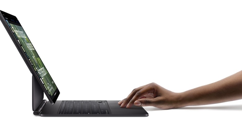 Person using Apple Magic Keyboard for iPad Pro